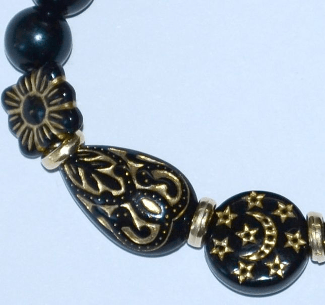 B81 - Bracelet perle acrylique ton noir et doré