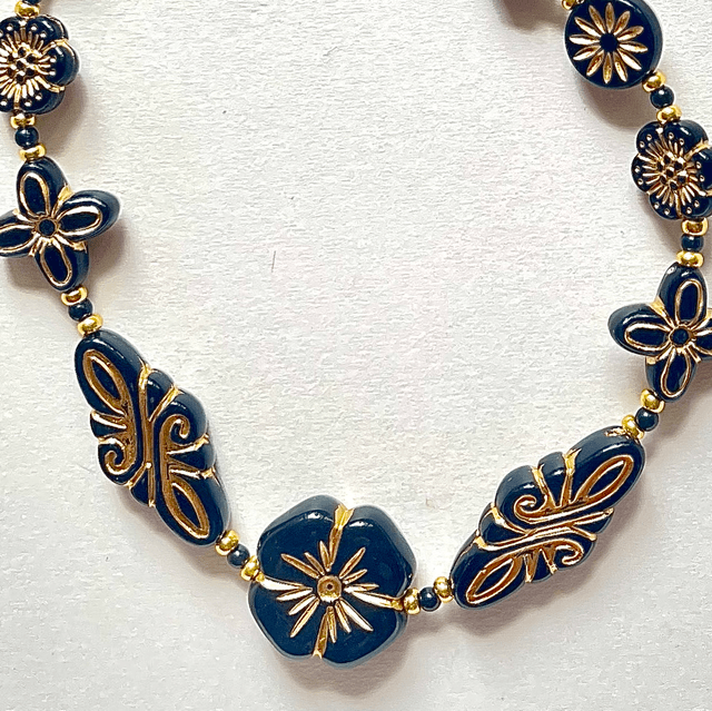C06 - Collier perle acrylique ton noir et doré